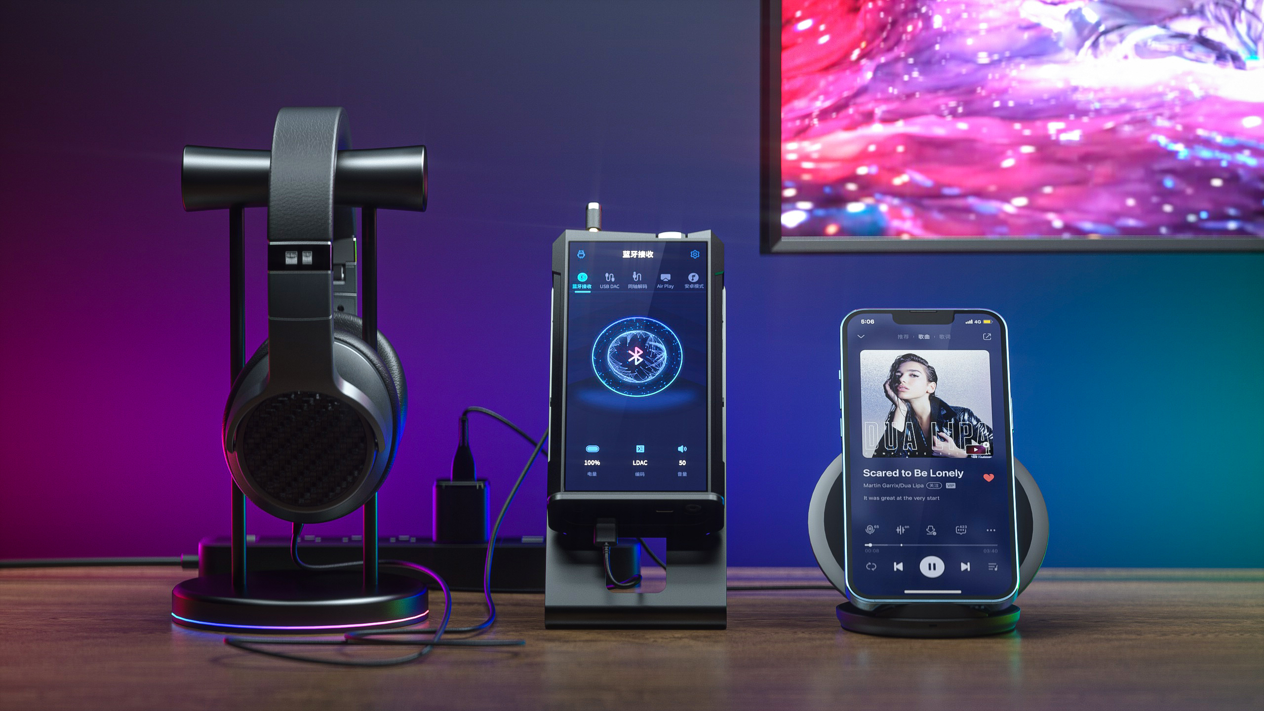 The FiiO M17 digital audio player sitting on a desk with headphones and a smartphone